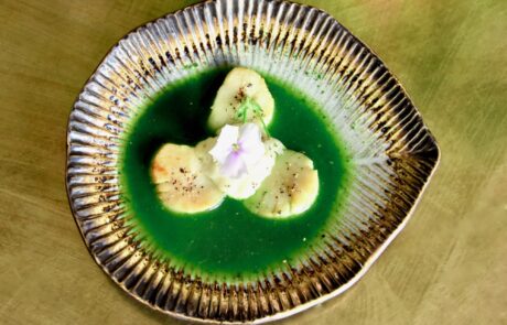 Scallops in nettle broth with horseradish lemon cream